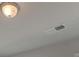 Standard ceiling with light fixture and air vent at 320 Tulip Dr, Covington, GA 30016
