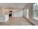 Bright open space with a modern kitchen, and views to the backyard, showing many windows at 320 Tulip Dr, Covington, GA 30016