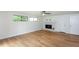 Finished basement with bright windows, modern ceiling fan, and a cozy fireplace at 4700 Cascade Sw Rd, Atlanta, GA 30331