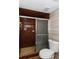 Shower with brown tile and sliding glass doors at 4700 Cascade Sw Rd, Atlanta, GA 30331