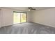 Bedroom featuring grey carpet floors and sliding glass doors to backyard at 4700 Cascade Sw Rd, Atlanta, GA 30331