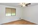 Bedroom featuring a ceiling fan, a window and hardwood floors at 4700 Cascade Sw Rd, Atlanta, GA 30331
