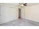Bright bedroom featuring neutral walls, plush carpeting, and closet for ample storage at 4700 Cascade Sw Rd, Atlanta, GA 30331