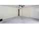 Spacious bedroom featuring neutral walls, plush carpeting, and a modern ceiling fan at 4700 Cascade Sw Rd, Atlanta, GA 30331