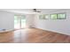 Bedroom featuring wood floors, white walls, and natural light from the windows at 4700 Cascade Sw Rd, Atlanta, GA 30331