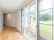 Hallway featuring natural light and hardwood floors and doors to the backyard at 4700 Cascade Sw Rd, Atlanta, GA 30331