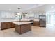 Bright kitchen featuring white countertops, wooden cabinets, stainless steel appliances, and an island at 4700 Cascade Sw Rd, Atlanta, GA 30331