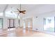 Bright living room featuring hardwood floors, vaulted ceilings, and a modern front door at 4700 Cascade Sw Rd, Atlanta, GA 30331