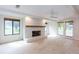 Cozy living room with a white brick fireplace and lots of natural light at 4700 Cascade Sw Rd, Atlanta, GA 30331