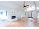 Living room featuring hardwood floors, fireplace, vaulted ceilings, and a modern front door at 4700 Cascade Sw Rd, Atlanta, GA 30331