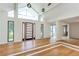 Bright living room with vaulted ceilings, hardwood floors, and a modern front door at 4700 Cascade Sw Rd, Atlanta, GA 30331