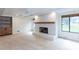Relax in this charming living room featuring a brick fireplace and ample natural light at 4700 Cascade Sw Rd, Atlanta, GA 30331
