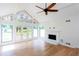 Living room featuring hardwood floors, fireplace, vaulted ceilings, and French doors at 4700 Cascade Sw Rd, Atlanta, GA 30331