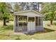 Charming pool house with screened windows and a lattice foundation on a grassy lawn at 4700 Cascade Sw Rd, Atlanta, GA 30331