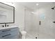 Stylish bathroom with a glass shower, decorative tile, and blue vanity at 4785 Merlendale Ct, Atlanta, GA 30327