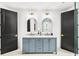 Stylish bathroom featuring double vanity with marble countertop and modern fixtures at 4785 Merlendale Ct, Atlanta, GA 30327