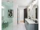 Elegant bathroom with a glass shower, marble floors, and double vanity with stylish mirrors at 4785 Merlendale Ct, Atlanta, GA 30327
