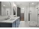 Elegant bathroom with double vanity, walk-in shower, and modern fixtures at 4785 Merlendale Ct, Atlanta, GA 30327