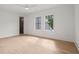 Bedroom boasts neutral decor, hardwood floors, a ceiling fan, and large windows at 4785 Merlendale Ct, Atlanta, GA 30327