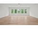 Bright bedroom with hardwood floors and an abundance of natural light from multiple windows at 4785 Merlendale Ct, Atlanta, GA 30327