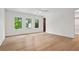 Bright bedroom with hardwood floors, white walls, large windows, and convenient closet access at 4785 Merlendale Ct, Atlanta, GA 30327