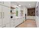 Butler's pantry featuring a window and floating shelves, cabinetry, and appliances at 4785 Merlendale Ct, Atlanta, GA 30327