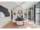 Sophisticated dining room featuring a modern chandelier, sleek furnishings, and ample natural light at 4785 Merlendale Ct, Atlanta, GA 30327