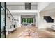 Grand foyer featuring soaring ceilings, wood floors, staircase with black iron railings, and an open floor plan at 4785 Merlendale Ct, Atlanta, GA 30327