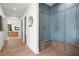 Hallway with wood floors and custom blue storage cabinets at 4785 Merlendale Ct, Atlanta, GA 30327