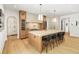 Kitchen with a large island, seating, custom cabinetry, and modern lighting fixtures at 4785 Merlendale Ct, Atlanta, GA 30327