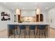 Bright kitchen features a large island with seating, modern lighting, and stainless steel appliances at 4785 Merlendale Ct, Atlanta, GA 30327