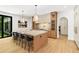 Gourmet kitchen featuring a large island with seating, pendant lighting, and modern appliances at 4785 Merlendale Ct, Atlanta, GA 30327