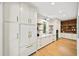 Well-designed kitchen with white cabinetry, open shelving, and modern stainless steel appliances at 4785 Merlendale Ct, Atlanta, GA 30327