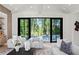 Chic living room with a view of the pool, stylish seating, and an open layout perfect for entertaining at 4785 Merlendale Ct, Atlanta, GA 30327