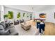 Inviting living room with large windows, comfortable seating, and a games area with a ping pong table at 4785 Merlendale Ct, Atlanta, GA 30327