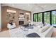 Bright and inviting living room featuring modern decor, a fireplace, and floor-to-ceiling sliding glass doors at 4785 Merlendale Ct, Atlanta, GA 30327