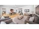Spacious living room featuring stylish furniture, a ping pong table, and elegant decor at 4785 Merlendale Ct, Atlanta, GA 30327