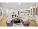 Open-concept living area with comfortable seating, built-in bar, and modern decor at 4785 Merlendale Ct, Atlanta, GA 30327