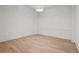 Bright room featuring light wood flooring, panel molding, and a modern light fixture at 4785 Merlendale Ct, Atlanta, GA 30327