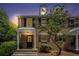Charming brick townhome featuring black shutters, dormer windows, and a welcoming covered entrance at 6700 Roswell Ne Rd # 25A, Sandy Springs, GA 30328
