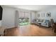 Bright living room with hardwood floors, modern furniture, and access to outdoor patio at 6700 Roswell Ne Rd # 25A, Sandy Springs, GA 30328