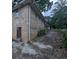 Exterior view of a brick home with a back door and a driveway at 735 S Grand Nw Ave, Atlanta, GA 30318