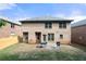 Brick home backyard with grill on patio, set up for outdoor entertaining at 1181 Gateview Dr, Lawrenceville, GA 30046