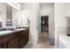 Bathroom features dual sinks and a large mirror with a walk-in closet at 1181 Gateview Dr, Lawrenceville, GA 30046