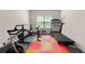Exercise room features a treadmill, weight lifting station, and stationary bike at 1181 Gateview Dr, Lawrenceville, GA 30046