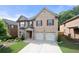 Beautiful two-story brick home with a well-manicured lawn and a two-car garage at 1181 Gateview Dr, Lawrenceville, GA 30046