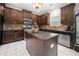 Well-equipped kitchen featuring an island, stainless steel appliances, and dark wood cabinetry at 1181 Gateview Dr, Lawrenceville, GA 30046