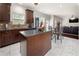 Spacious kitchen with island, breakfast area, and seamless flow into the adjacent living room at 1181 Gateview Dr, Lawrenceville, GA 30046