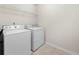 Laundry room featuring a white washer and dryer, offering convenience and functionality at 1181 Gateview Dr, Lawrenceville, GA 30046