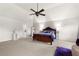 Spacious main bedroom features a ceiling fan, lounge chair, and ample natural light at 1181 Gateview Dr, Lawrenceville, GA 30046